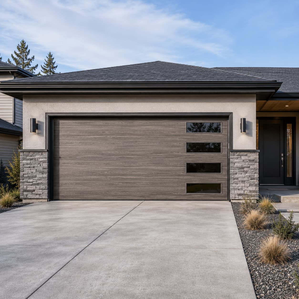 Wood-look steel door with glass inserts on a modern Spokane home